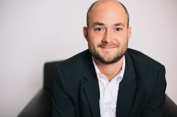 Dr. Chris McAlister, smiling in a portrait photo.